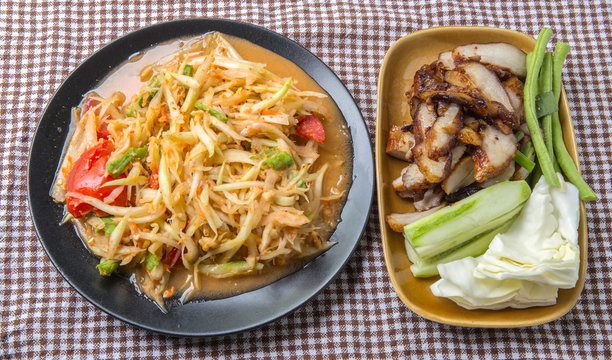 Closeup Thai papaya, charcoal-boiled pork neck,Grill pork (popular food Thailand)
