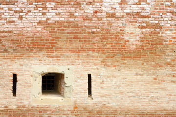 window on ancient brick wall