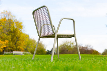 metal chair on a green lawn