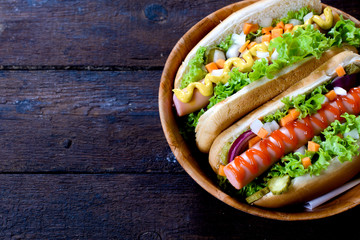 Hot dogs on wooden background