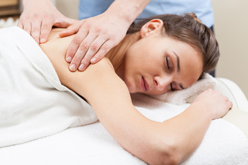 Fototapeta na wymiar Woman having arm massage in spa