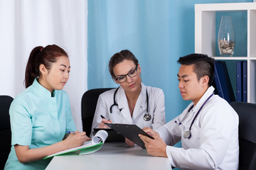 Fototapeta premium Doctors talking about patient