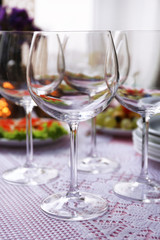 Buffet table with dishware waiting for guests