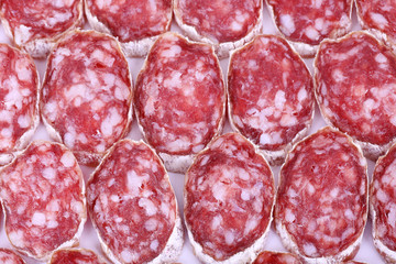 Slices of salami as background