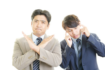 禁止の意思表示をするビジネスマン