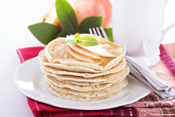 Stack of vegan pancakes with almond milk