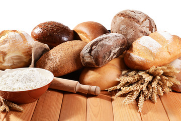 Fresh bread on table on white background