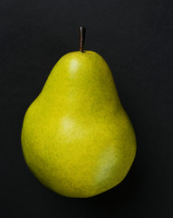 Pear on black background