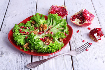 Fresh salad with greens, garnet and spices