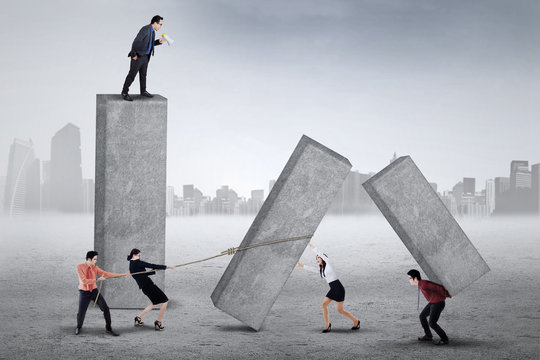 Bossy businessman commanding his workers