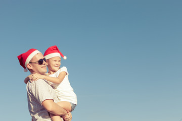 father and little daughter playing near a house