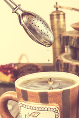 Tea straining in retro vintage style