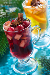 Christmas mulled wine and apple cider on blue background
