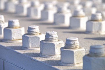 Closeup of big bolt and nut on bridge