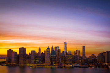 Downtown Manhattan skyline and the East River at sunset, includi