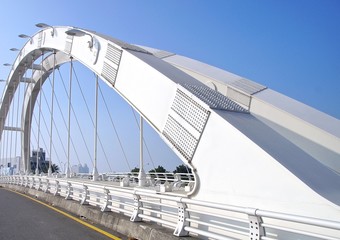 The arch of a modern suspension bridge