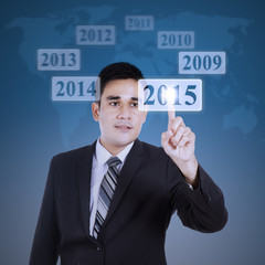 Male worker pushing a virtual button