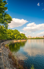 Fototapeta na wymiar Beautiful colors of Central Park with lake reflections at dusk -