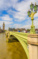 LONDON - SEPTEMBER 29, 2013: Tourists walk on Westminster Bridge