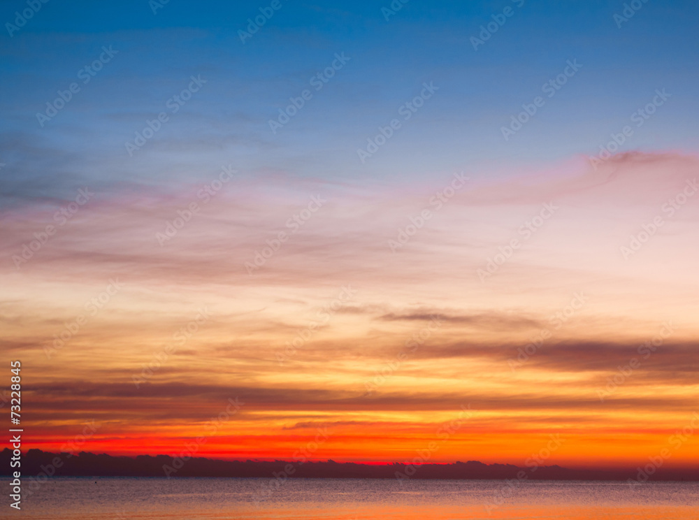 Wall mural beautiful cloudscape landscape sunrise from the beach