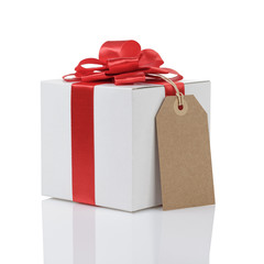 gift box with handmade red ribbon bow and tag