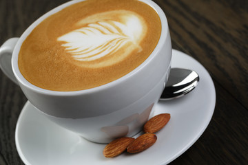 cup of fresh cappuccino with latte art