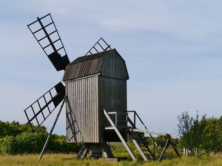 Fototapeta na wymiar A wooden wind mill on Oeland in Sweden