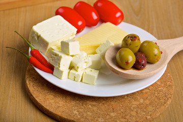 Olives, cheese and tomatos on a plate