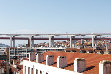 Fototapeta premium 25 de Abril Bridge close-up and Lisbon cityscape