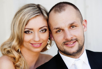 Portrait of happy young bride and groom