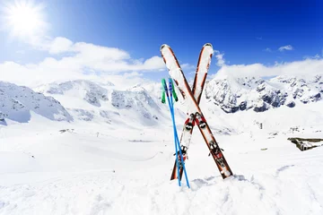 Fotobehang Skiing , mountains and ski equipments on ski run © Gorilla