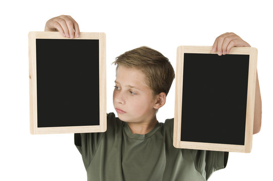 Boy between two black boards left