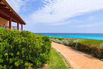 Coastal promenade in Cala Mesquida bay, Majorca island, Spain