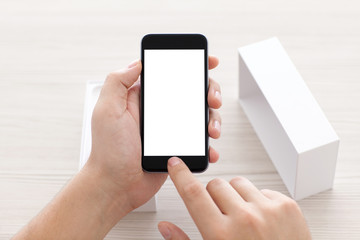 male hands holding phone with isolated screen