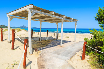Sunshade construction on path to  Rei beach, Sardinia