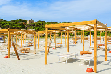 Hammocks and sunbeds on Porto Giunco beach, Sardinia island