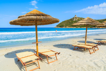 Villasimius beach with sunchairs and umbrellas, Sardinia island