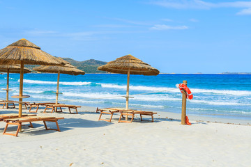 Villasimius beach with sunchairs and umbrellas, Sardinia island