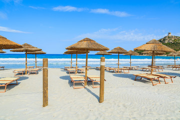 Villasimius beach with sunchairs and umbrellas, Sardinia island