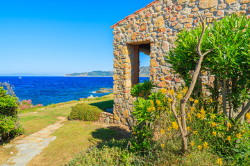 Naklejka premium Traditional house on coast of Sardinia island near Cala Caterina