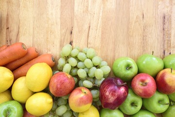 Naklejka na ściany i meble Organic fruits and vegetables mixed on the plank