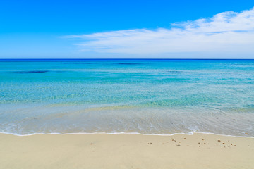 Fototapeta na wymiar Turquoise sea water on coast of Porto Giunco bay, Sardinia