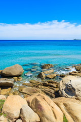 Fototapeta na wymiar Rocks and azure sea water of Porto Giunco beach, Sardinia island