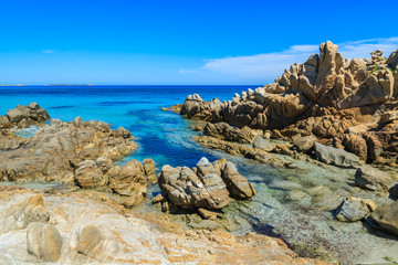 Fototapeta na wymiar Rocks and azure sea water of Porto Giunco beach, Sardinia island