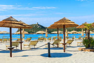 Umbrellas and sunchairs on Porto Giunco beach, Sardinia island