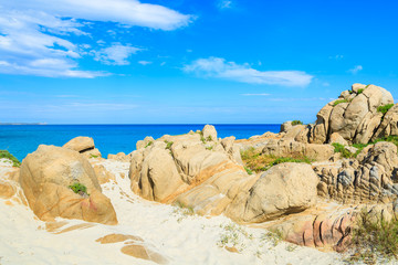 Fototapeta na wymiar Rocks on sand dunes at Porto Giunco beach, Sardinia island