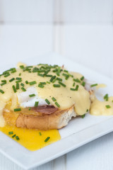 Eggs Benedict toasted English muffins ham poached eggs and holla