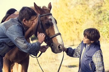 Fototapeta premium horse ride young guy autumn forest