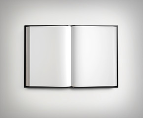 Open blank textbook on light gradient