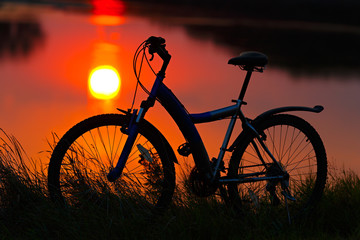 Fototapeta na wymiar bike on the sunset background.
